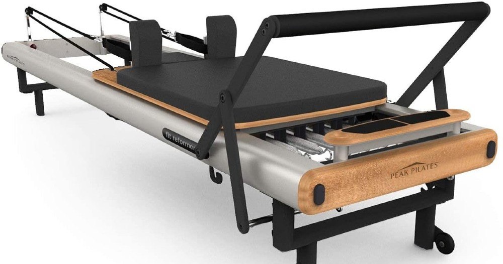 Peak Pilates fit Reformer, showing aluminum frame and with foot bar in up position