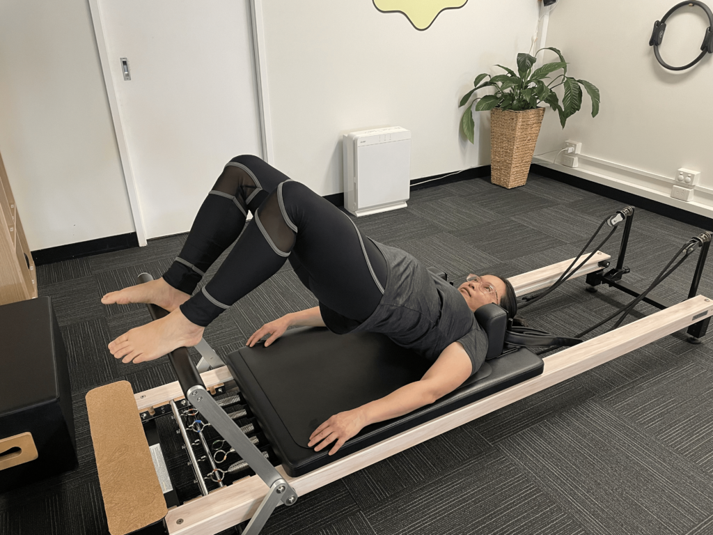 Original photo Side lying leg work - leg fully extended towards foot bar